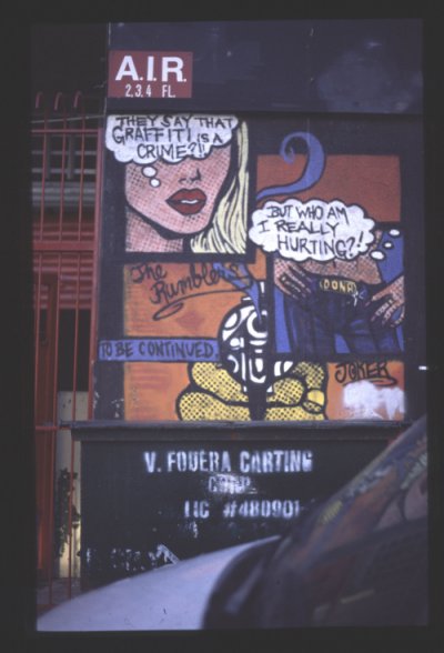 Graffiti tekstillä "They say that graffiti is a crime?! But who am I really hurting?!"."